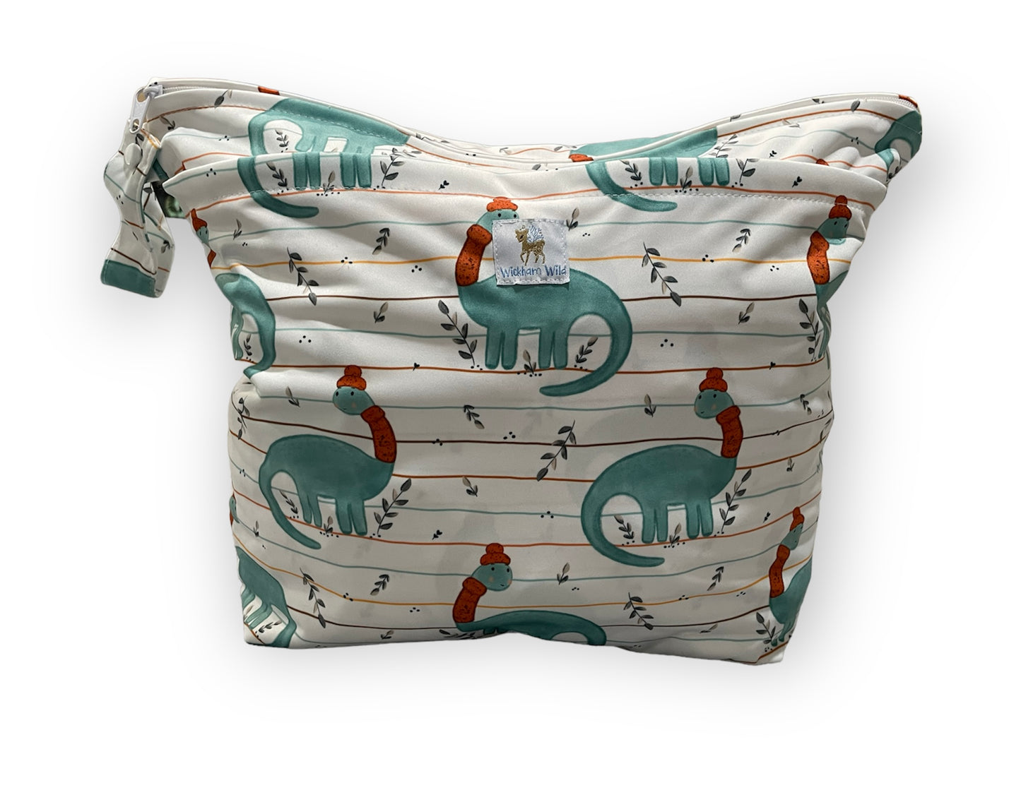 Patterned 3d bottom wet bag with dinosaur design on a white background. The dinosaur has a scarf and winter hat on. You can see the Wickham Wild logo tag, 2 zipper openings, and a small strap with a snap closure. 