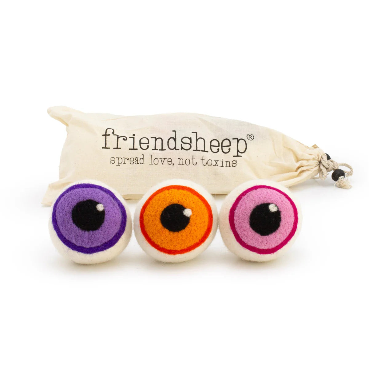 Three colorful eye-shaped wool dryer balls with a 'friendsheep' branded drawstring bag on a white background.