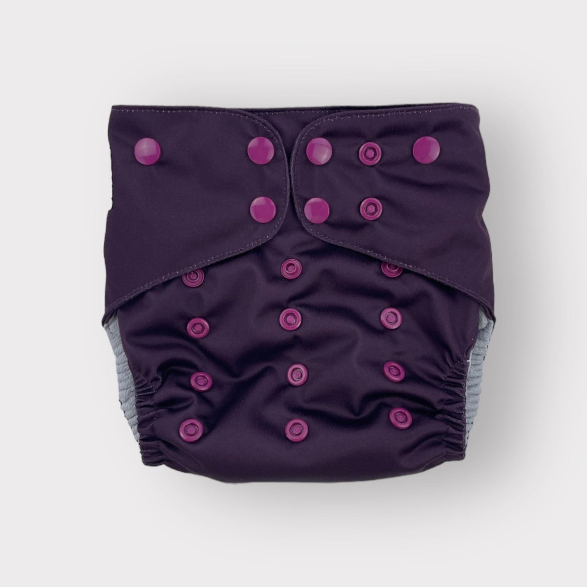 A deep wine/burgungy colored pocket style reusable diaper from Wickham Wild.