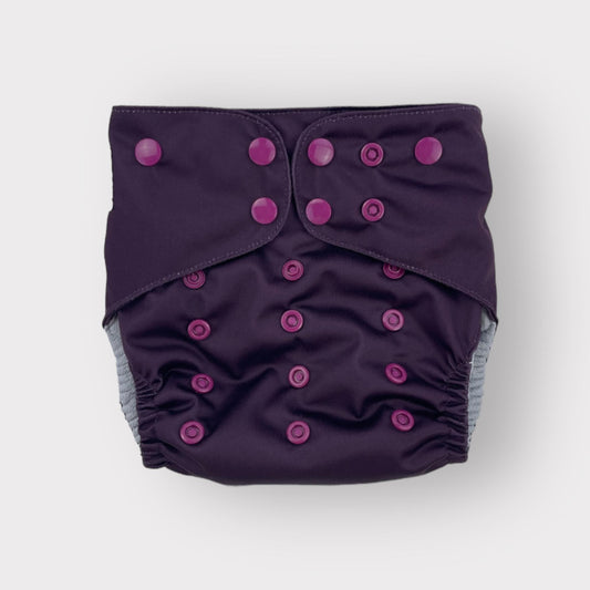 A deep wine/burgungy colored pocket style reusable diaper from Wickham Wild.
