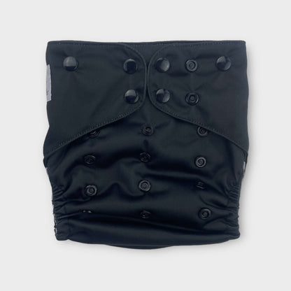 a solid black reusable diaper from wickham wild. the snaps are also black.