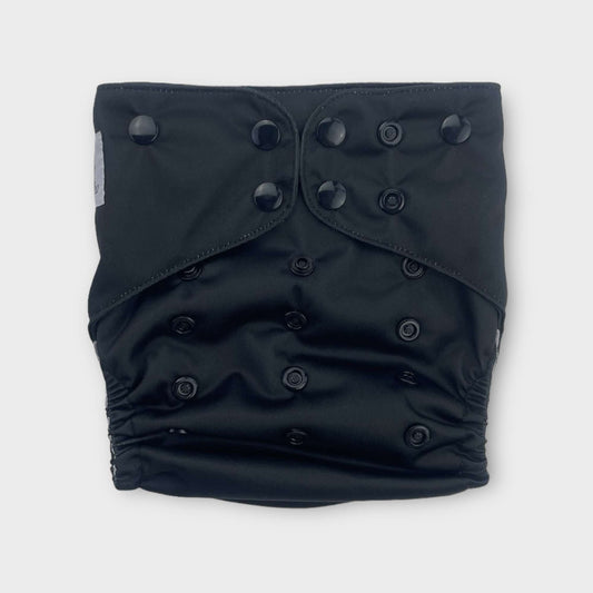 a solid black reusable diaper from wickham wild. the snaps are also black.